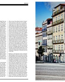 Road traveling towards homes by the sea, on cover of 'Curves: Portugal, Band 14', by Delius Klasing.