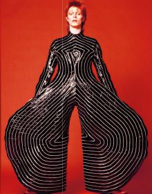 Polaroid shots of David Bowie in different poses, on black cover of 'David Bowie by Sukita', by Delius Klasing.