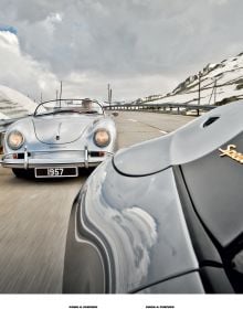 Cream Porsche 356 with small boat on roof rack traveling on road with mountains behind, on cover of 'Cars & Curves Vol.2', by Delius Klasing Verlag GmbH.