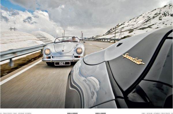 Cream Porsche 356 with small boat on roof rack traveling on road with mountains behind, on cover of 'Cars & Curves Vol.2', by Delius Klasing Verlag GmbH.