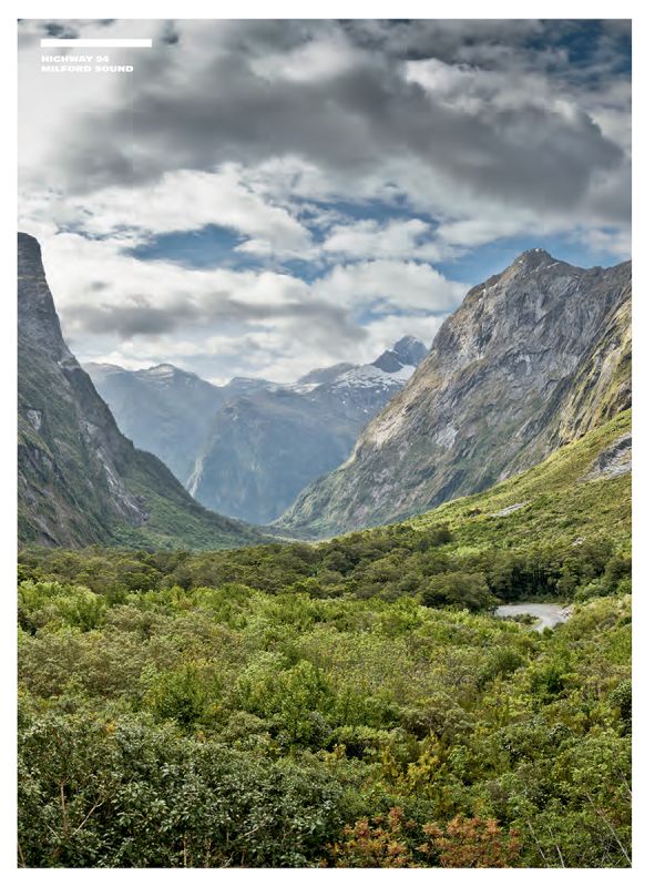 Book cover of Stefan Bogner's CURVES New Zealand: Volume 22, with a winding road on the coast, with snow covered mountains behind. Published by Delius Klasing.