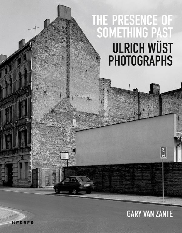 Book cover of The Presence of Something Past: Ulrich Wüst Photographs, with a residential street. Published by Kerber.