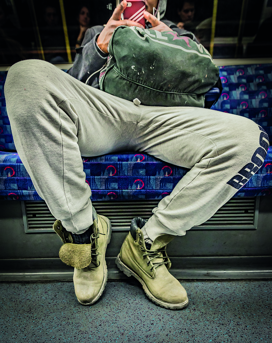 Grey Jubilee line, Westminster, tube stop, UNDERGROUND PORTRAITS, in blue, white and red font, Wolfgang Strassl in grey font below