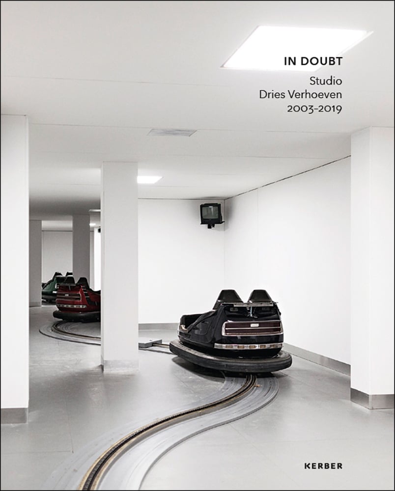 Book cover of Dries Verhoeven: In Doubt. Studio Dries Verhoeven 2003-2019; with three bumper cars on a track. Published by Kerber.