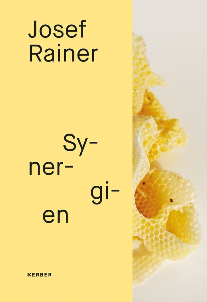 Josef Rainer Sy-ner-gi-en in black font on lemon yellow left banner, with honeycomb sculpture obscured to right side