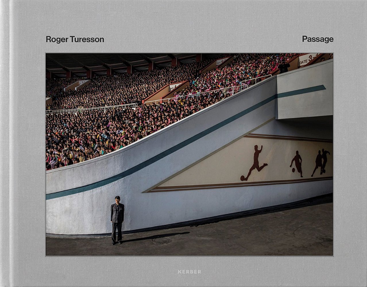 Lone figure standing near entrance to large sports stadium packed with spectators, on grey landscape cover, Roger Turesson Passage in black font above.