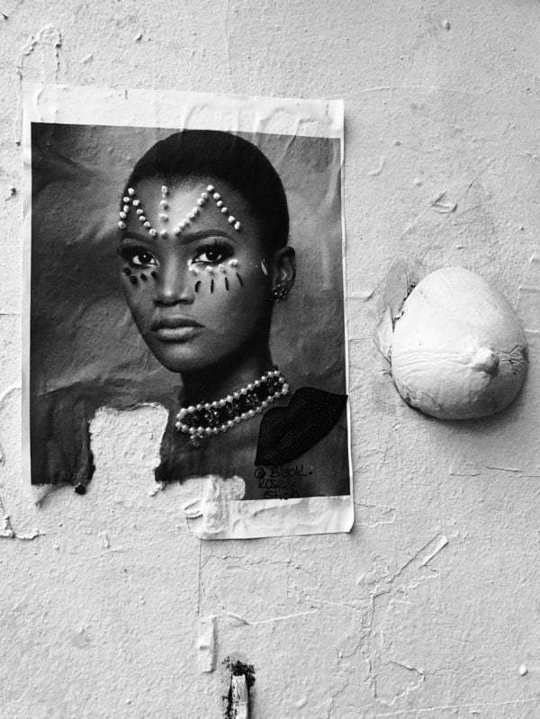 Black and white seascape with cliff edges, Anthony Curri ATLAS MOKSHA in black font