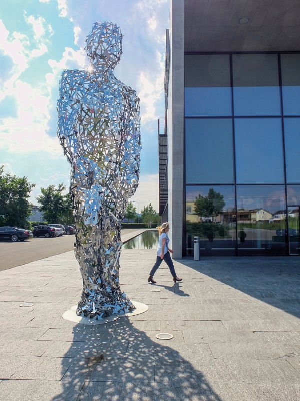 Book cover of Hans Thomann: Human - Body - Figure, with a stencil of human figure standing on end of plank. Published by Kerber.