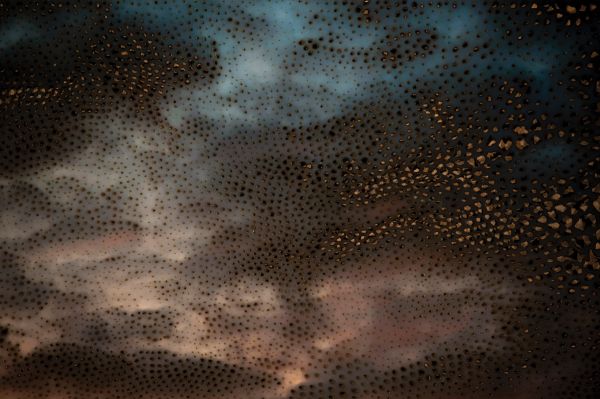 Book cover of Miguel Rothschild: Premonition, with a blue sky white clouds. Published by Kerber.