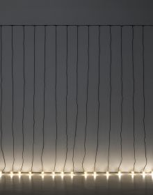 Book cover of Opera Opera: Allegro ma non troppo, with a string of illuminated light bulbs hanging down in exhibition space. Published by Kerber.