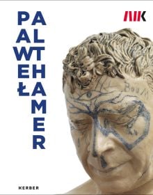 Cream glazed sculpture of head with blue drawings to face, PAWE? ALTHAMER, in blue font down left side of cover.