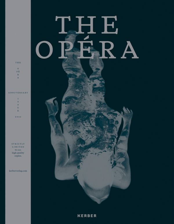 Book cover of The Opéra: Anniversary Issue - 2022, with a photograph negative of nude female swimming under water. Published by Kerber.