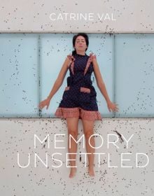 Book cover of Catrine Val: Memory Unsettled, featuring a female laying on beige stone and glass floor, surrounded by black specs. Published by Kerber.