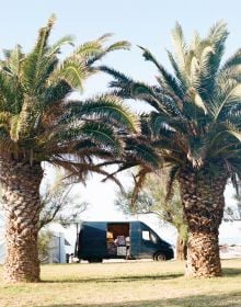 Campervan parked on sand, under blue sky, Riccardo Fregoso, Adriatico, in black font across orange cover.