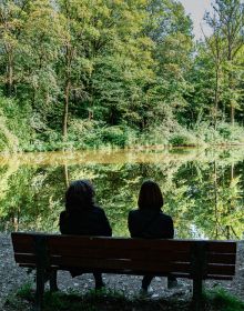 Green tree reflections on river, on cover of 'Wolfgang Strassl, Arcadian Sketchbook', by Kerber.