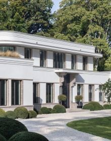 Façade of luxury villa with large glass panel door, 'Geiselhart', in white font above.