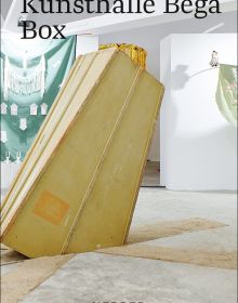 Art installation of tall wooden box shape falling into hole in floor, on cover of 'Kunsthalle Bega Box', by Kerber.