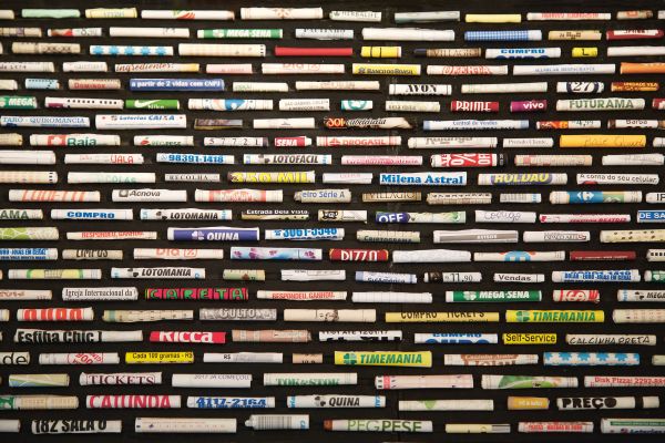 Book cover of Cinthia Marcelle, By Means of Doubt', with a red and white striped fabric tied with a bow. Published by Kerber.