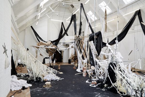 Book cover of Cinthia Marcelle, By Means of Doubt', with a red and white striped fabric tied with a bow. Published by Kerber.