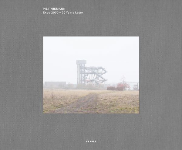 Multi-storey structure obscured by mist, on grey landscape cover of 'Piet Niemann, Expo 2000', by Kerber.