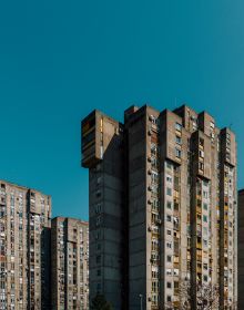 Tower block with red filter, on cover of 'Marius Svaleng Andresen, Life in the New', by Kerber.