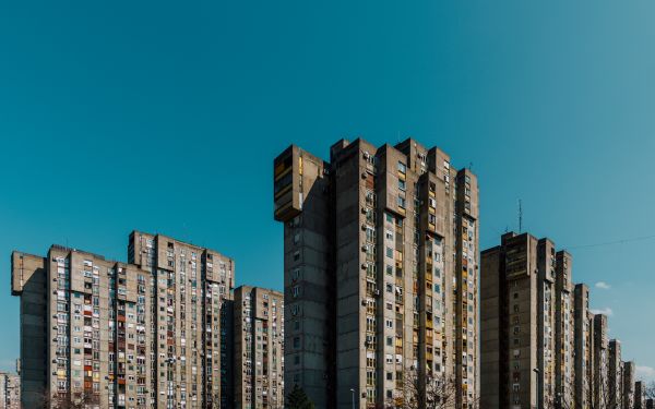 Tower block with red filter, on cover of 'Marius Svaleng Andresen, Life in the New', by Kerber.