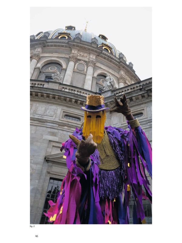 Repeated slide of pair of eyes, on mustard yellow cover of 'MOMENTA Biennale de l’image, Mascarades. L’attrait de la métamorphose', by Kerber.