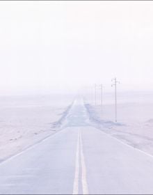 White landscape book cover of Rainer Zerback, The World Without Us, featuring a seascape with diving platform, misty mountains behind. Published by Kerber.