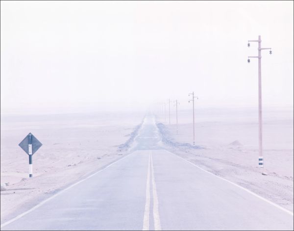 White landscape book cover of Rainer Zerback, The World Without Us, featuring a seascape with diving platform, misty mountains behind. Published by Kerber.