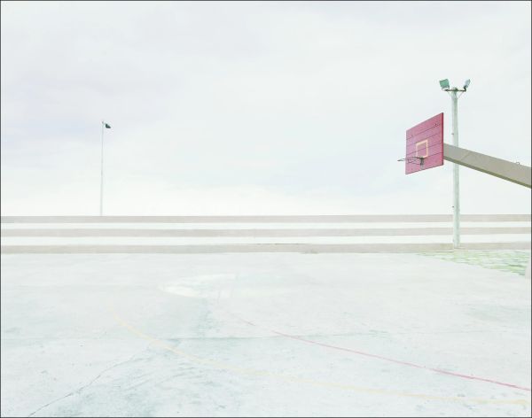 White landscape book cover of Rainer Zerback, The World Without Us, featuring a seascape with diving platform, misty mountains behind. Published by Kerber.