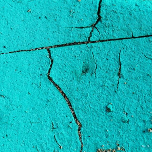 Cream book cover of Winfried Muthesius, 1.000 Odysseen, with capitalised black font. Published by Kerber.