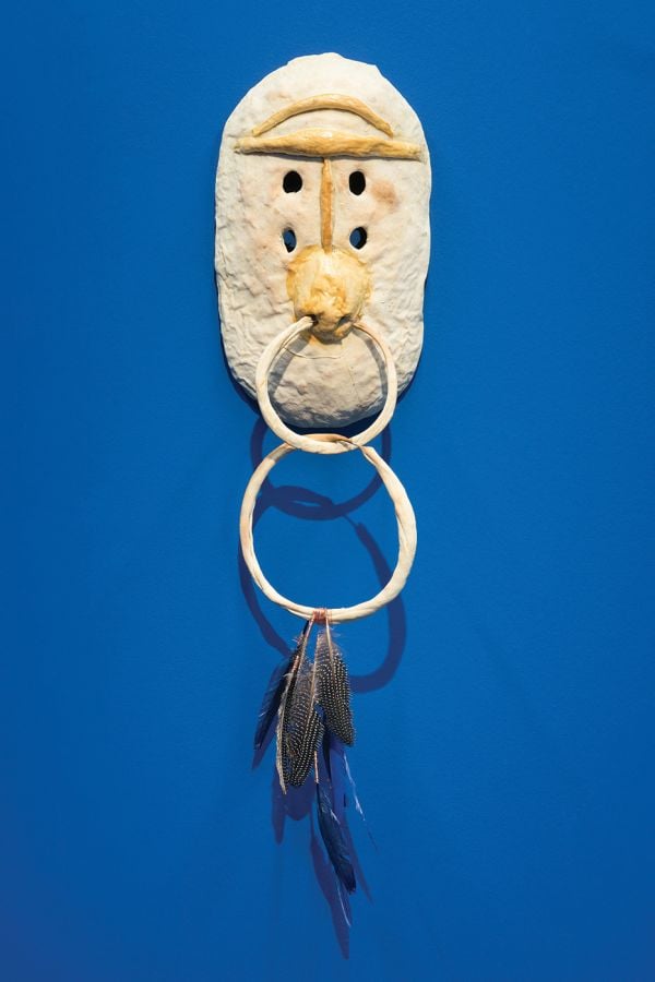 Book cover of La Chola Poblete: Guaymallén: Deutsche Bank Artist of the Year 2023, with the artist wrapped in black coat, and wearing purple lipstick. Published by Kerber.