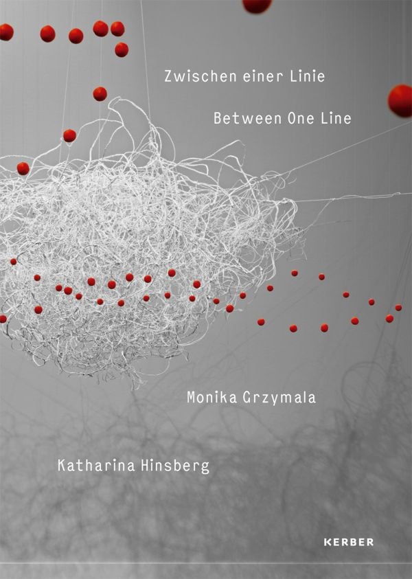 Book cover of Between One Line: Katharina Hinsberg & Monika Gryzmala, with an art installation of white wire and small red balls. Published by Kerber.
