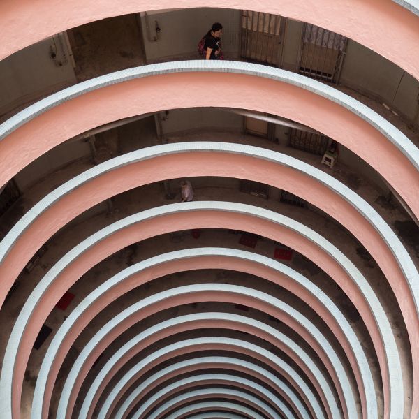 Book cover of Plattenbau Promenades: Christoph Montebelli: Berlin | Havana | Hong Kong | Zanzibar, with a concrete slab building. Published by Kerber.