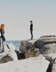 Book cover of Scenes from an Island: Florence Montmare, with two figures standing near a rocky coastline looking out to sea. Published by Kerber.