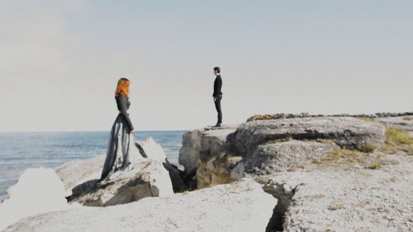 Book cover of Scenes from an Island: Florence Montmare, with two figures standing near a rocky coastline looking out to sea. Published by Kerber.
