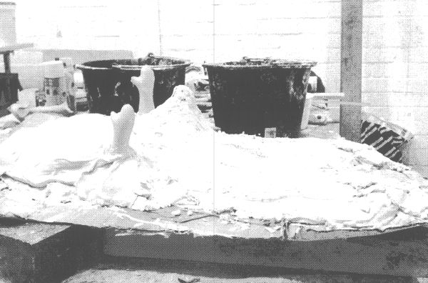 Book cover of Iris Musolf: 39th of May; featuring an art exhibit resembling a gun, inside a clear box. Published by Kerber.