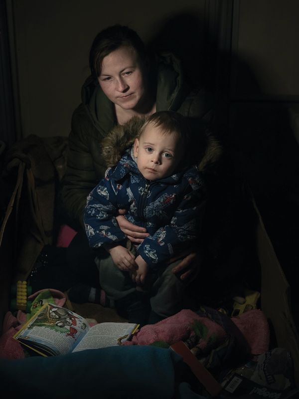 Book cover of Faces of War: Alexander Chekmenev, featuring a lone figure with a fire raging behind. Published by Kerber.