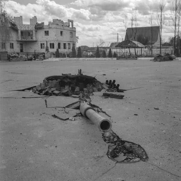 Book cover of Faces of War: Alexander Chekmenev, featuring a lone figure with a fire raging behind. Published by Kerber.