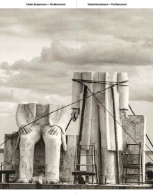 Book cover of The Monument: Sibylle Bergemann; featuring two large stone figures with their head and shoulders missing. Published by Kerber.