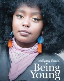Book cover of Being Young: Portraits of Becoming; featuring a portrait of young woman with a septum piercing, wearing bold earrings and a pink scarf. Published by Kerber.