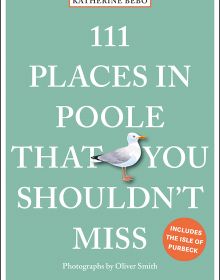 Seagull near center of pale green cover of '111 Places in Poole That You Shouldn't Miss', by Emons Verlag.