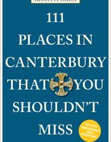 Gold Canterbury cross near centre of dark blue cover of '111 Places in Canterbury That You Shouldn't Miss', by Emons Verlag.