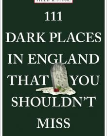 Grave stone with red rose near center of dark green cover of '111 Dark Places in England That You Shouldn't Miss', by Emons Verlag.