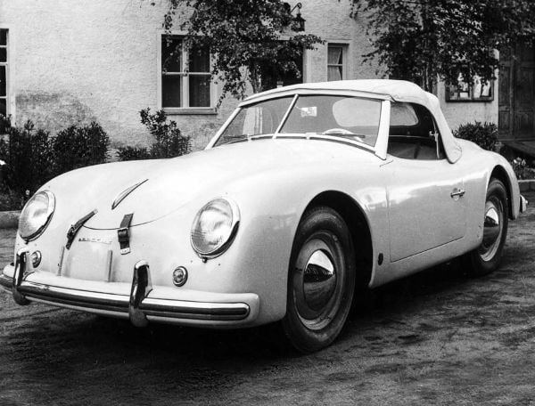 Porsche 930 near centre of bright yellow landscape cover of '111 More Porsche Stories That You Should Know', by Emons Verlag.