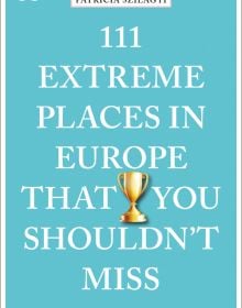 Golden double handled trophy near center of turquoise cover of '111 Extreme Places in Europe That You Shouldn't Miss', by Emons Verlag.