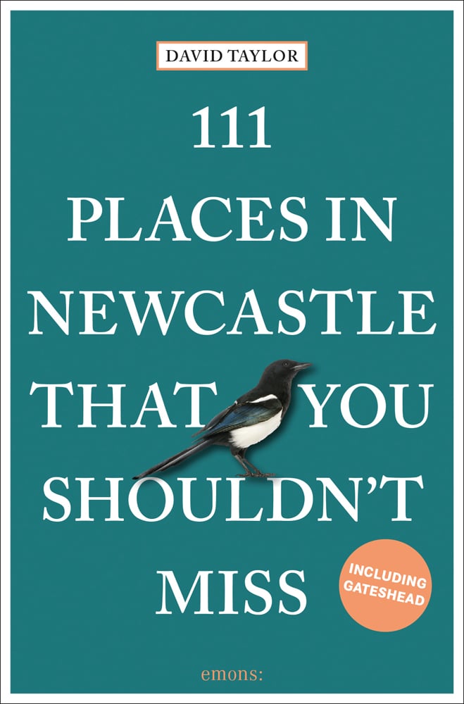 Magpie near centre of green cover of '111 Places in Newcastle That You Shouldn't Miss', by Emons Verlag.