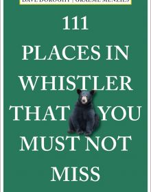Black bear cub near center of emerald green cover of '111 Places in Whistler That You Must Not Miss', by Emons Verlag.