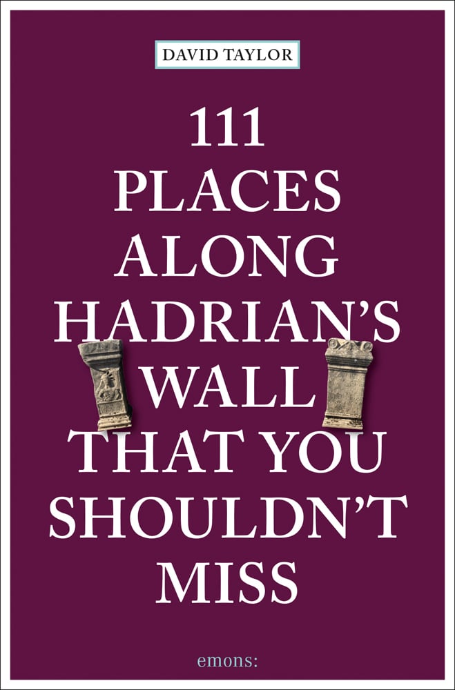 Two stone pillars near centre of dark purple cover of '111 Places Along Hadrian's Wall That You Shouldn't Miss', by Emons Verlag.