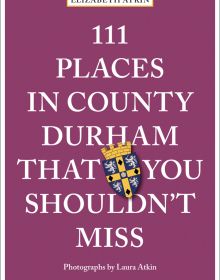Coat of arms near center of mulberry cover of '111 Places in County Durham That You Shouldn't Miss', by Emons Verlag.